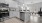 Spacious and well lit kitchen with wood flooring and stainless steel appliances